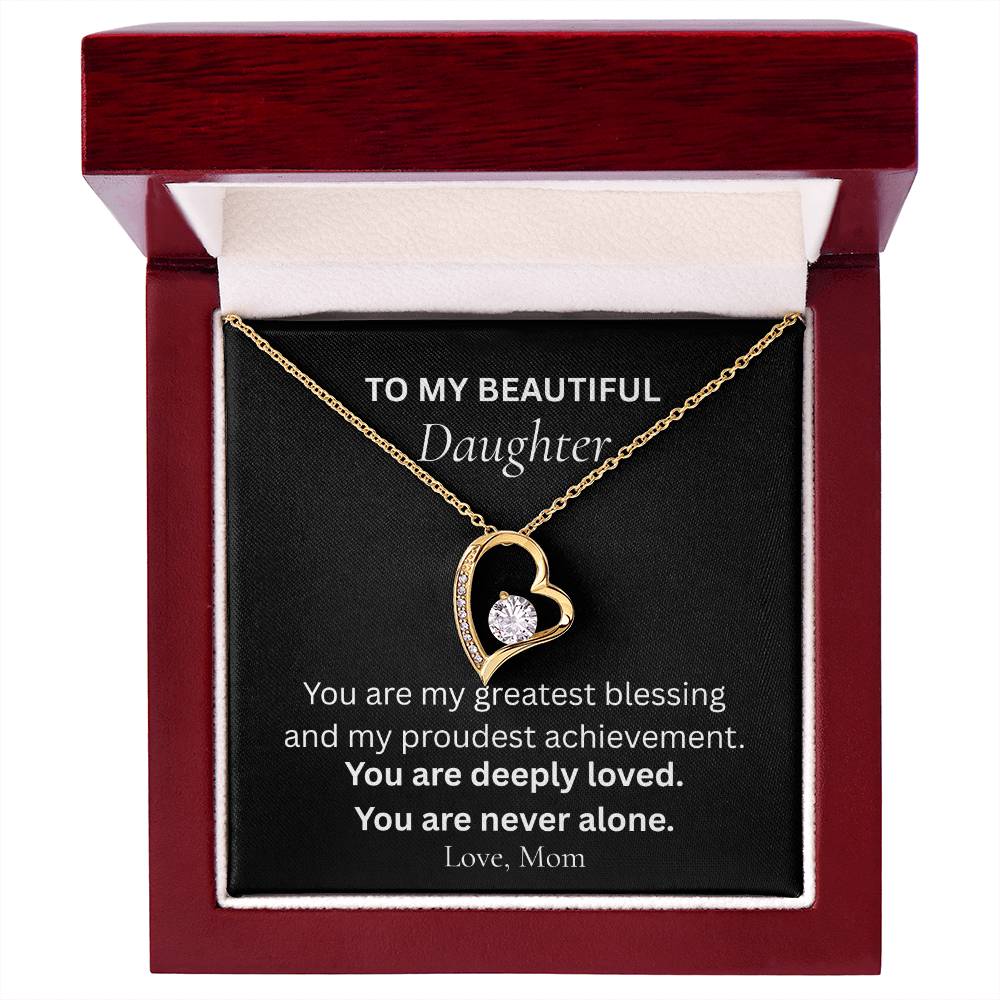 Yellow gold Forever Love necklace for daughter displayed with message card from Mom