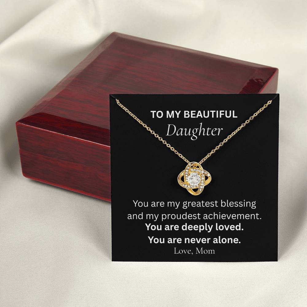 Gold Love Knot necklace for daughter from mom shown in keepsake gift box