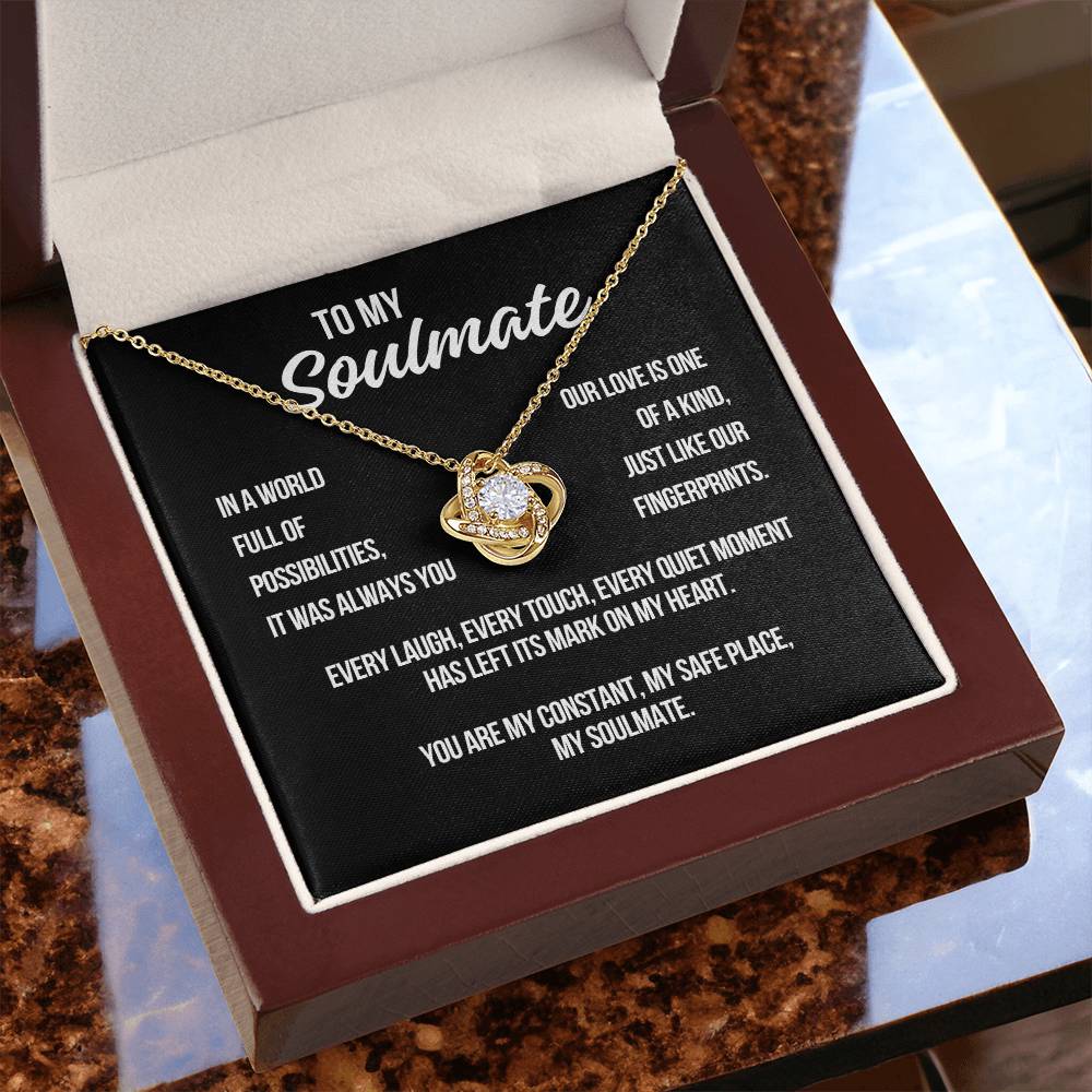 Yellow gold Love Knot Necklace displayed with black To My Soulmate message card in gift box
