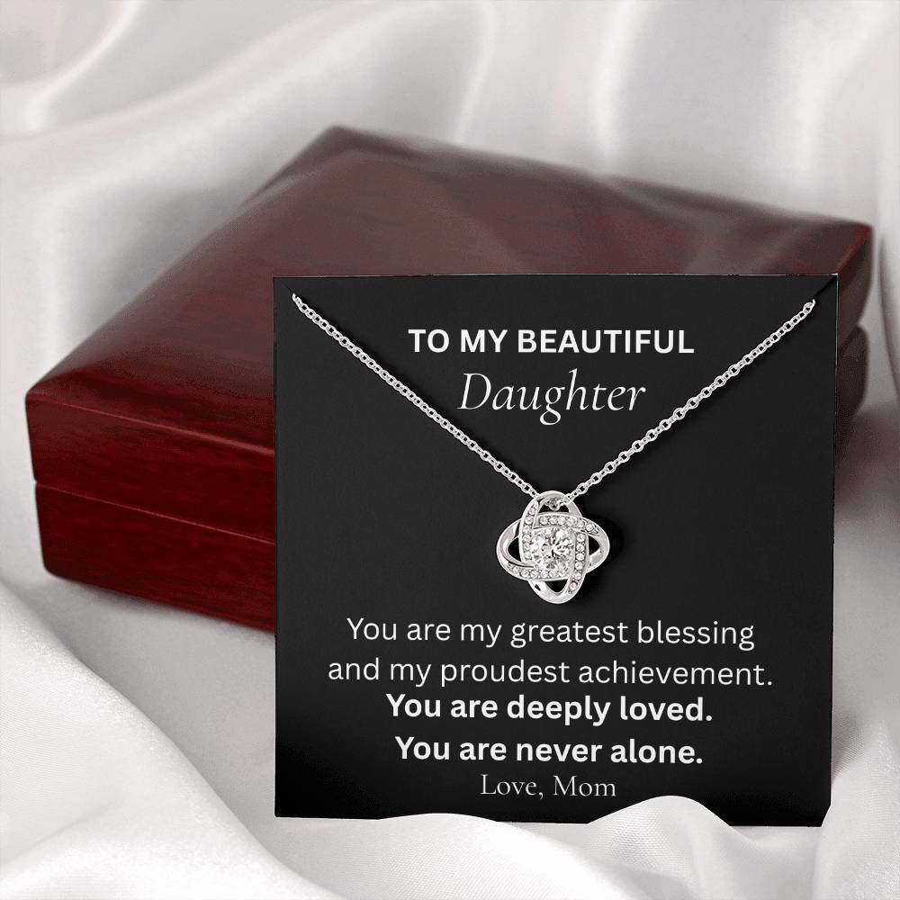 Close-up of Love Knot necklace message card for daughter from mom