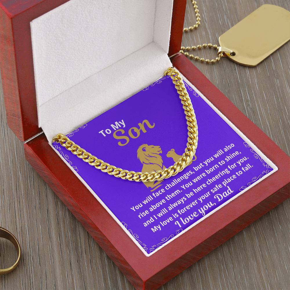 Angled view of gold Cuban link chain necklace in a luxury gift box with a heartfelt message card for a son about strength and resilience