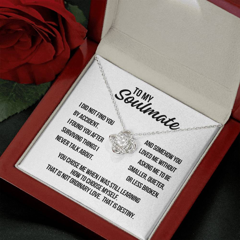 Angled view of To My Soulmate Love Knot Necklace in white gold with destiny message card on white background
