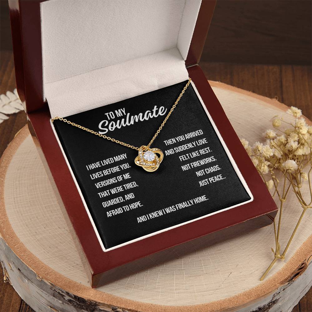 To my soulmate love knot necklace in yellow gold with black background message about love bringing peace