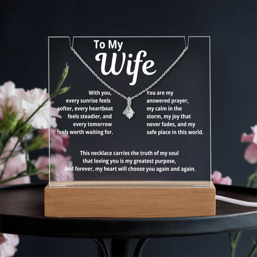 A glowing acrylic plaque for wife featuring the message “To My Wife” paired with the Alluring Beauty Necklace, displayed on a wooden LED base with a soft romantic background