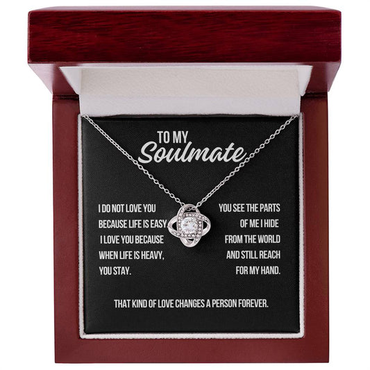 To my soulmate white gold love knot necklace on black background with message about staying when life is heavy and love changing a person forever
